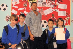 Dan Freedman is pictuted with St Cenydd pupils during his recent visit to the school.