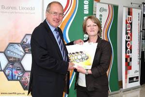 Cllr Ron Davies and Jocelyn Davies AM with a copy of the new Regeneration Strategy