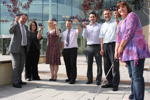 Caerphilly Council leader Lindsay Whittle (left) with the Ryder Cup ticket winners
