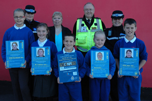 (Back row, left to right) PCSO Eve Churchward, Pam Farrant (Greater Bargoed Communities First Partnership), CSW Allan Davies and PCSO Cath Jones. (Front row, left to right) Pupils from years 4 and 6 at Ysgol Bro Sannan, Aberbargoed.