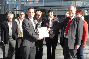 Councillor Hefin David (left) and AM Jeff Cuthbert with residents of Gelligaer, Nelson and Penybryn