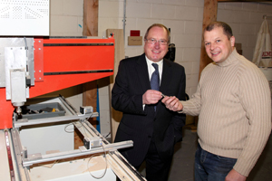 Paul Hogg of Craft Wales, right, gives Cllr Ron Davies a demonstration of the new equipment