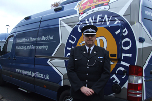 Superintendent Dave Johnson with one of the mobile police stations