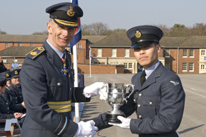 Piya receiving his trophy from Air Vice Marshall Mark-Green