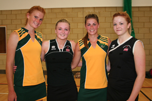 Two of the South African team with Coleg Gwent netballers (in black) Sophie Williams (left) and Chloe Turton (right)