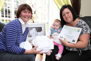 Cllr Lyn Ackerman hands over the Real Nappy prize to Joanne Mayo