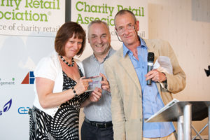 Karen O’Brian, manager of Cancer Research Wales' Caerphilly shop being presented the award