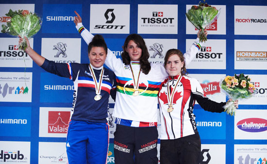 Manon Carprenter on the top step of the podium after winning the junior Mountain Bike Downhill World Championship