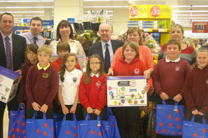Wayne David, Caerphilly MP, with some of the schoolchildren at Tesco Ystrad Mynach