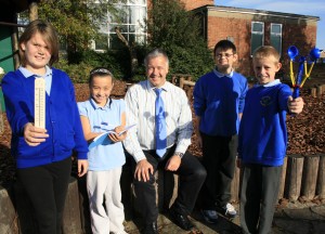 Derek Brockway with pupils at Derwendeg Primary School in Cefn Hengoed