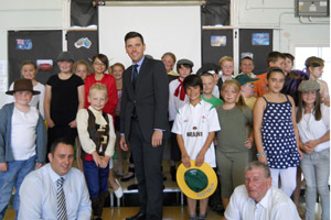Pupils of Maescywmmer Primary School with Islwyn MP Chris Evans, centre, Councillor Robin Woodyatt, right, and new headteacher James Harris, left