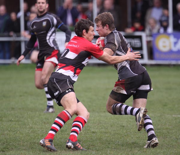 Bedwas scrum half Jonathan Evans takes on Pontypool's Tom Hancock