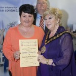 Jenny Clements receives her award from Mayor Gaynor Oliver. Also pictured is Deputy Principal Paul Martin