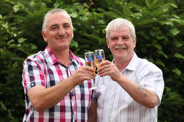 Work colleagues Chris Edwards (left) and Idris Tipper from Hengoed, who scooped Â£1 million in the EuroMillions 100 UK Millionaires draw on July 27 - ©Huw Evans Agency, Cardiff