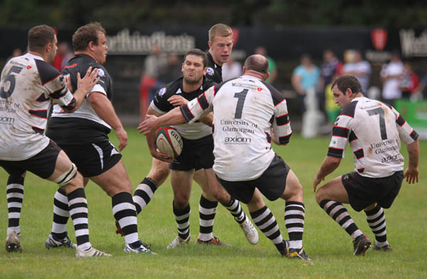 Bedwas full back Stuart Thomas runs into heavy trafiic versus Pontypridd