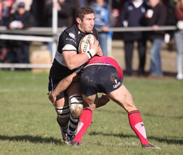 James Thomas is held up by a Bedford defender