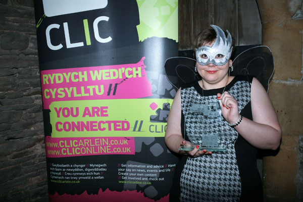 Emily posing with her award at the Caerphilly Castle ceremony