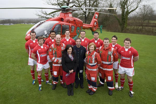 (left to right): Wales captain Sam Warburton is joined by fellow 2013 RBS 6 Nations squad members Leigh Halfpenny, Toby Faletau, George North, Jamie Roberts, Mike Phillips, James Hook and Jonathan Davies alongside crew members of the ‘new generation’ Wales Air Ambulance which could have up to 300-plus new landing sites thanks to a new Welsh Rugby Union backed scheme nominating rugby clubs around the country which could accommodate the lifesaving helicopter.