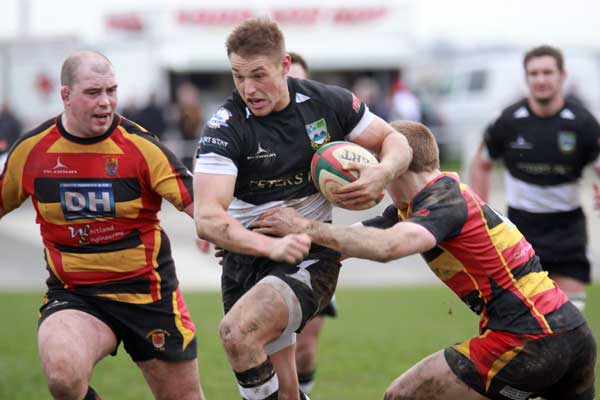 Lewis Robling breaks through the Carmarthen defence
