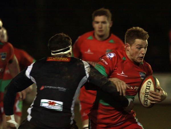 Lewis Robling looks for a way through the Cross Keys defence
