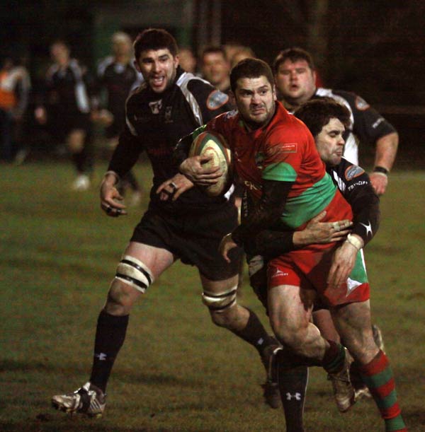 Stuart Thomas is held by the Cross Keys defence
