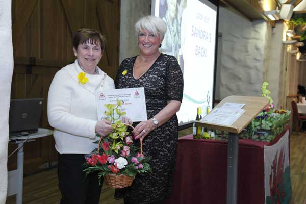 Carol Lloyd receives an award for 25 years of continuous service as a School Crossing Patrol 