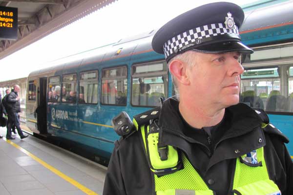 Inspector Mike Edwards using a BWV camera on a station patrol at Cardiff Central.