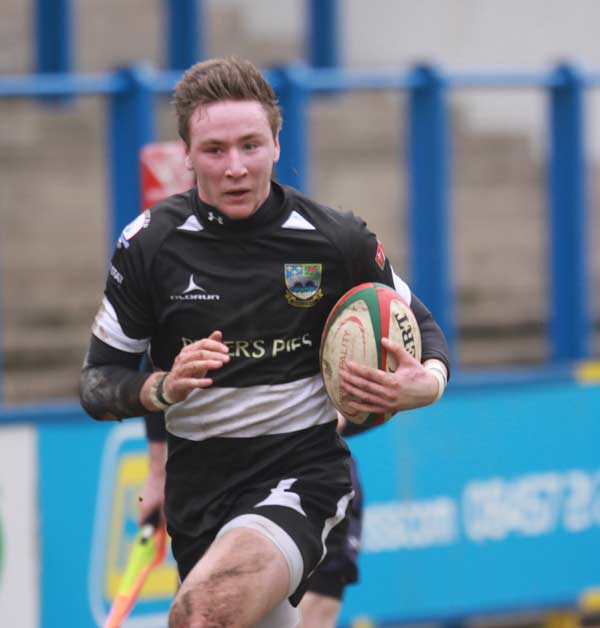 Lewis Hudd charges through for a try versus Cardiff