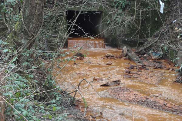 The river Rhymney between Bedwas and Machen has turned orange - Picture by Environment Agency