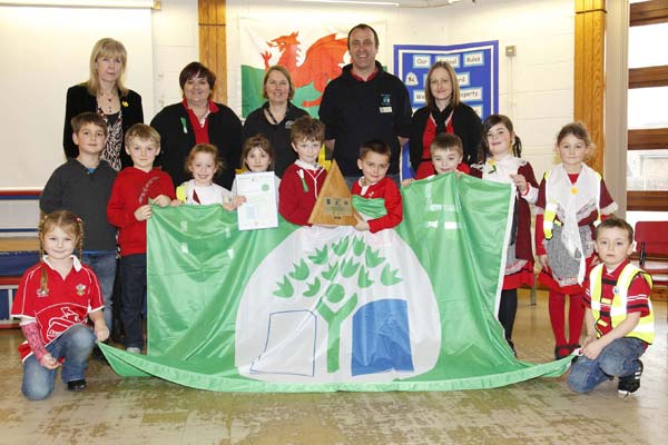 Staff and pupils from Llanfabon Infants with CCBC's Tracy Evans, Education for Sustainable Development Officer and Matthew Bunt, Eco Schools Officer.