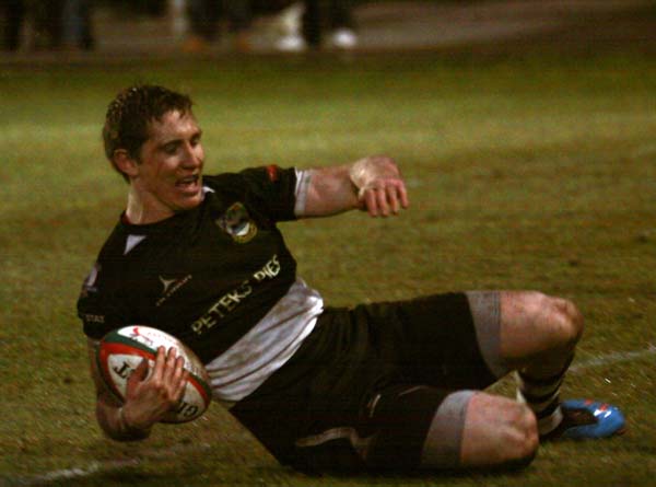 Matthew Pewtner slides in for his second try versus Swansea