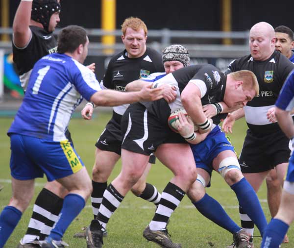 Rhys Hutcherson drives into the waiting Bridgend defence.jpg