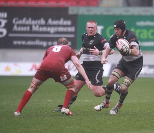 Second row Kyle Maiden takes on Llanelli's Craig Price