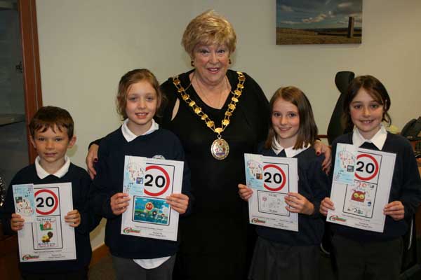 Cllr Gaynor Oliver with (left to right) William Dewi, aged eight, Holly Pipe, nine, winner Beca Evans Lugg, nine, and Delun Thomas, also nine