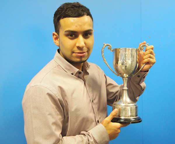 Usmaan Nasir with his Welsh Chartered Quality Institute award