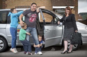 TAXI!: (left to right) Tomos, 12, Dylan, six, Dad Lee Burksfield, Sam, six, Mum Gaynor Burksfield