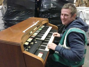 HITTING THE RIGHT NOTE: Alex Chamberlain of Caerphilly Auctions tries out the organ