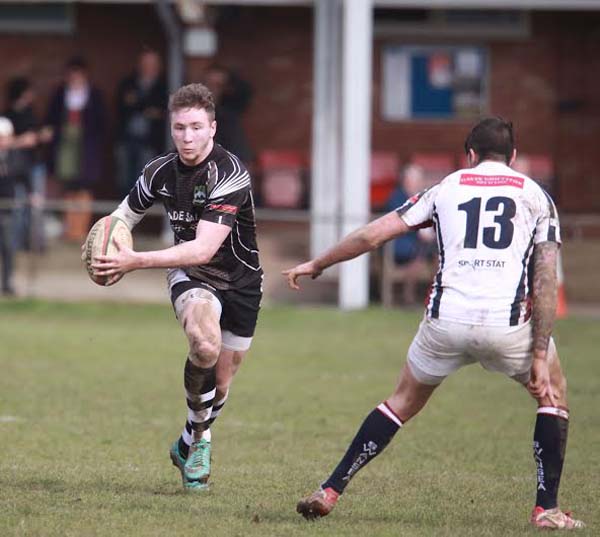 TRY SCORER: Bedwas fullback Lewis Hudd attempts to break the Swansea line