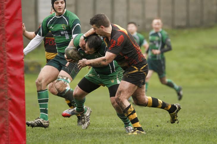 BULLDOZER: Chris Thomas powers his way across the line