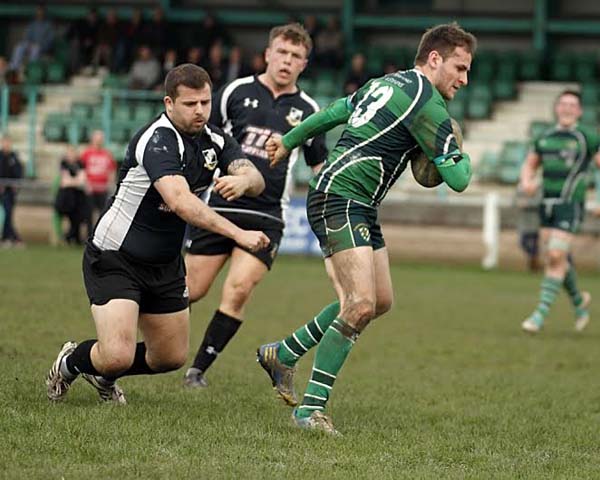 DANCING FEET: Will Worthington evades the Harriers defence to score