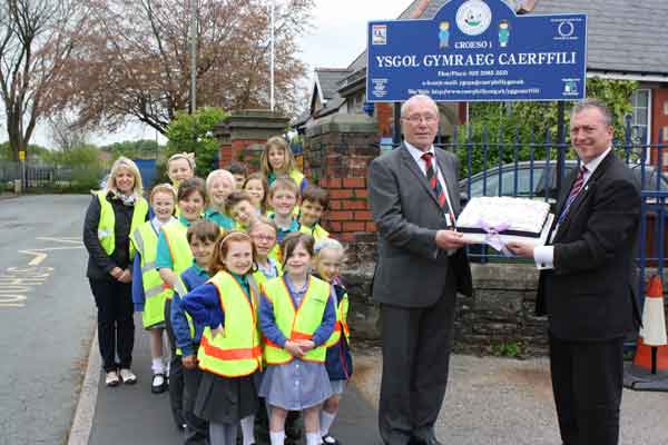 WALK THIS WAY: Cllr Tom Williams, Cabinet Member for Highways, Transportation and Engineering and Lynn Griffiths, headteacher of Ysgol Gynradd Gymraeg Caerffili with pupils
