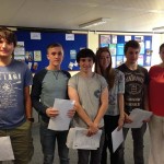 (left to right) Thomas Mitchell, 18, Rhys Turner, 17, Geraint Clash, 18, Sophie Rees, 18, Sam Stevens, and St Cenydd's headteacher Rebecca Collins.
