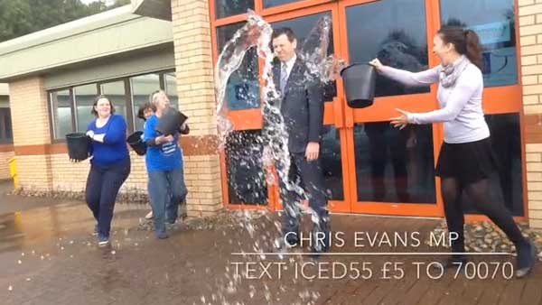 ALL DRESSED UP WITH NOWHERE TO GO: Chris Evans MP gets a drenching 