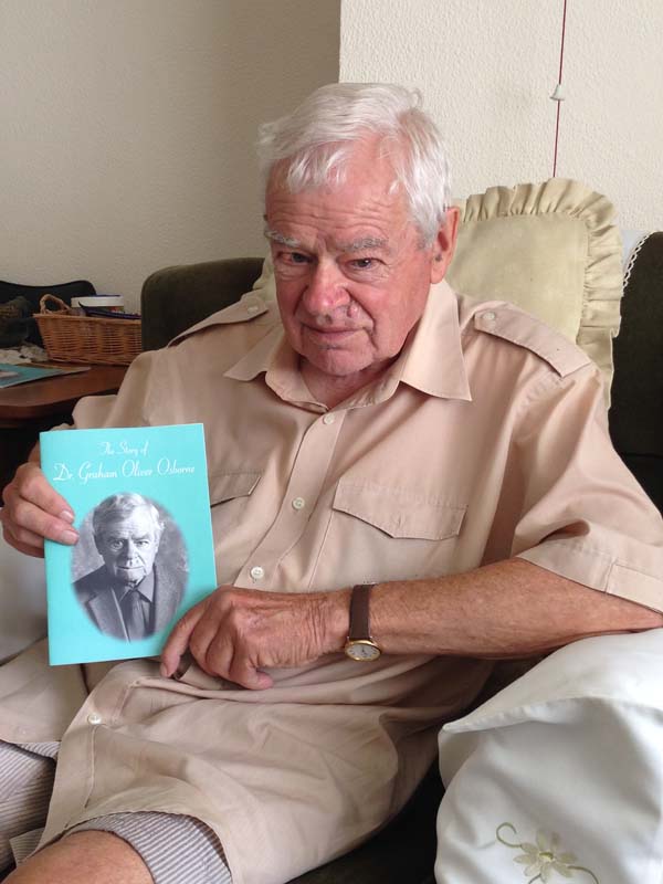 LIFE AND TIMES: Dr Graham Osborne with a copy of his book