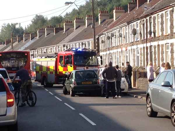 Firefighters at the scene of the bus crash in Llanbradach 