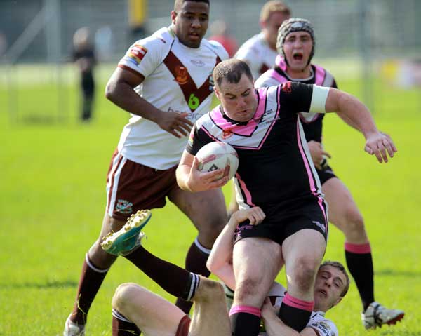 Scorpions' Scott Giles tries to power through a tackle