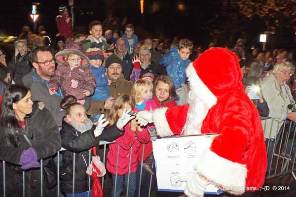 PRESENTS: Santa gave out gifts before switching on the lights Picture by Dean Williams, Van Camera Club