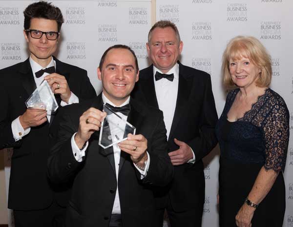 Joe Miles of Xibo (left), Andy Mudie of Nuaire,  Jamie Owen, and Chair of Caerphilly Business Forum Denise Lovering