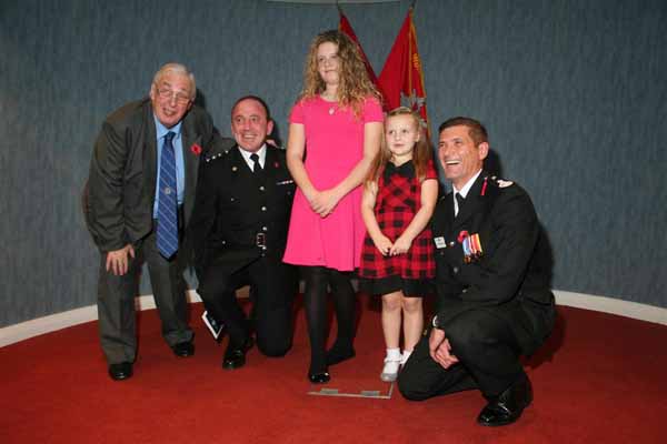 HEROINES: Paige and Olivia with fire chiefs 