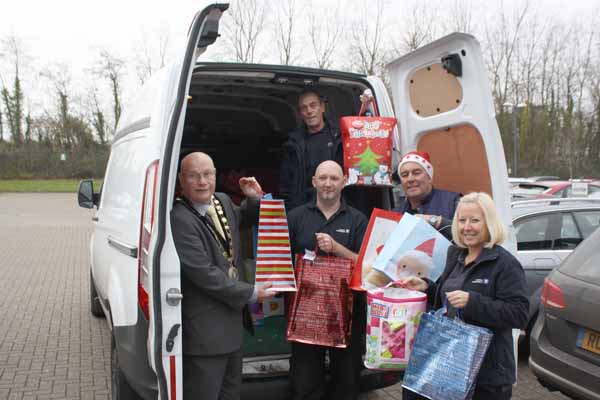 GIFTS: Caerphilly County Borough Mayor David Carter collecting gifts from Zodiac Seats UK